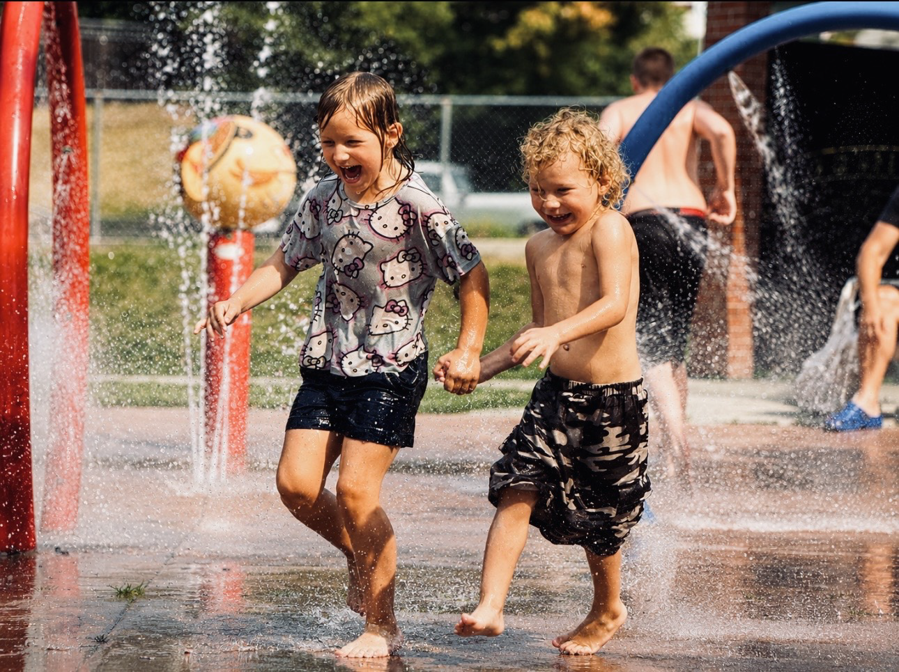 Children playing together at a Cranbrook splash park